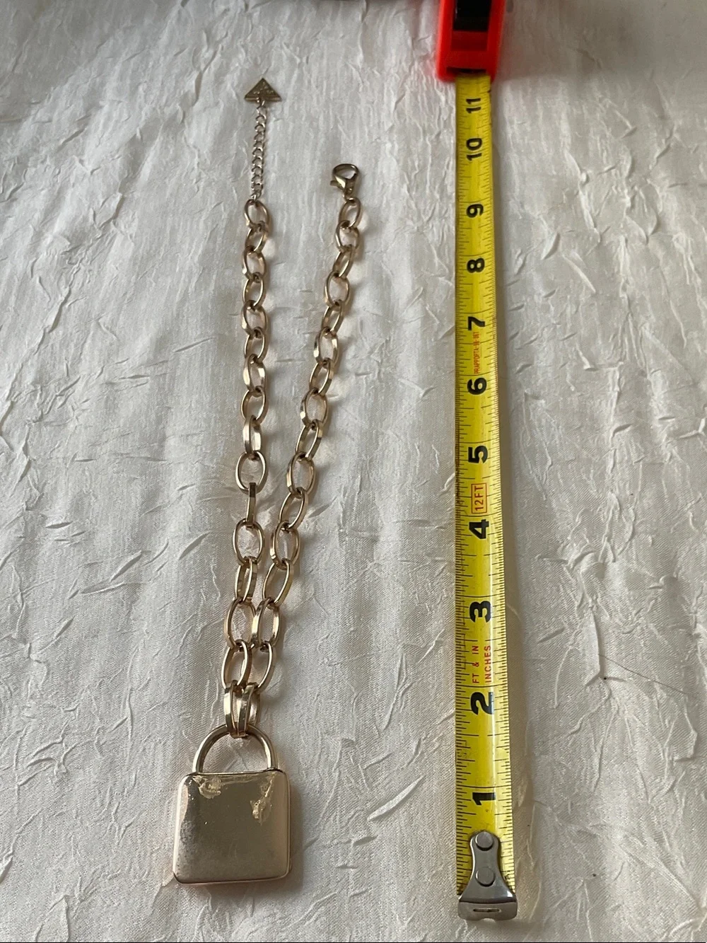 GUESS Gold Padlock Pendant with Floral Accent